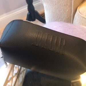 Black Dior cosmetic bag